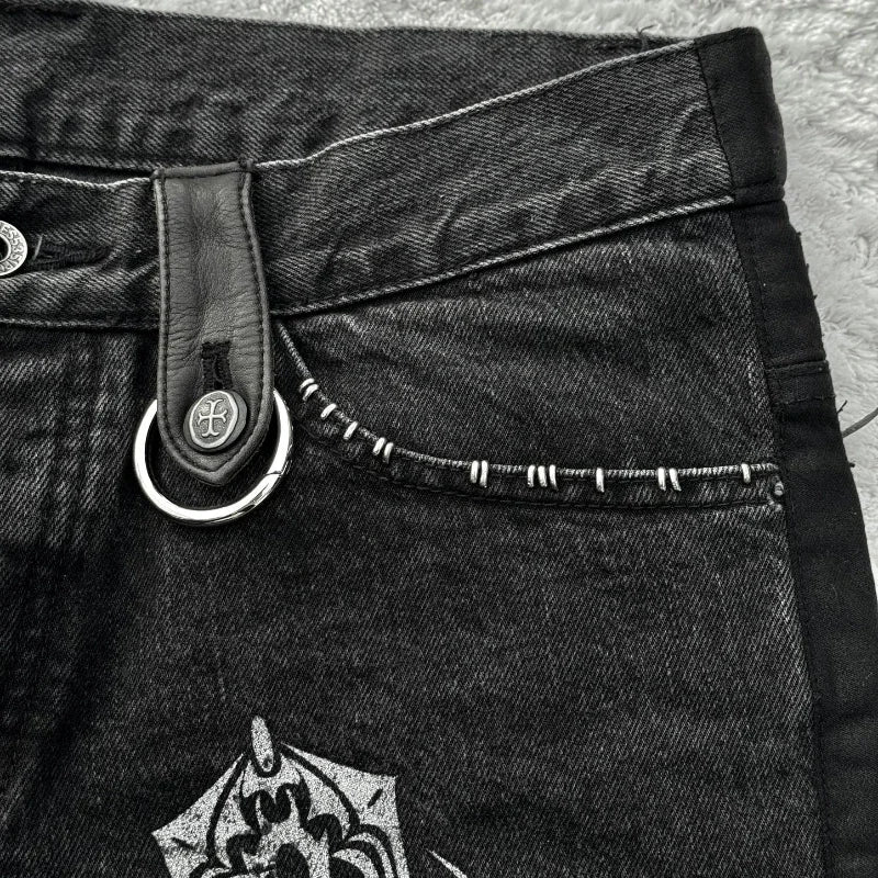 Washed denim jeans with decorative pockets