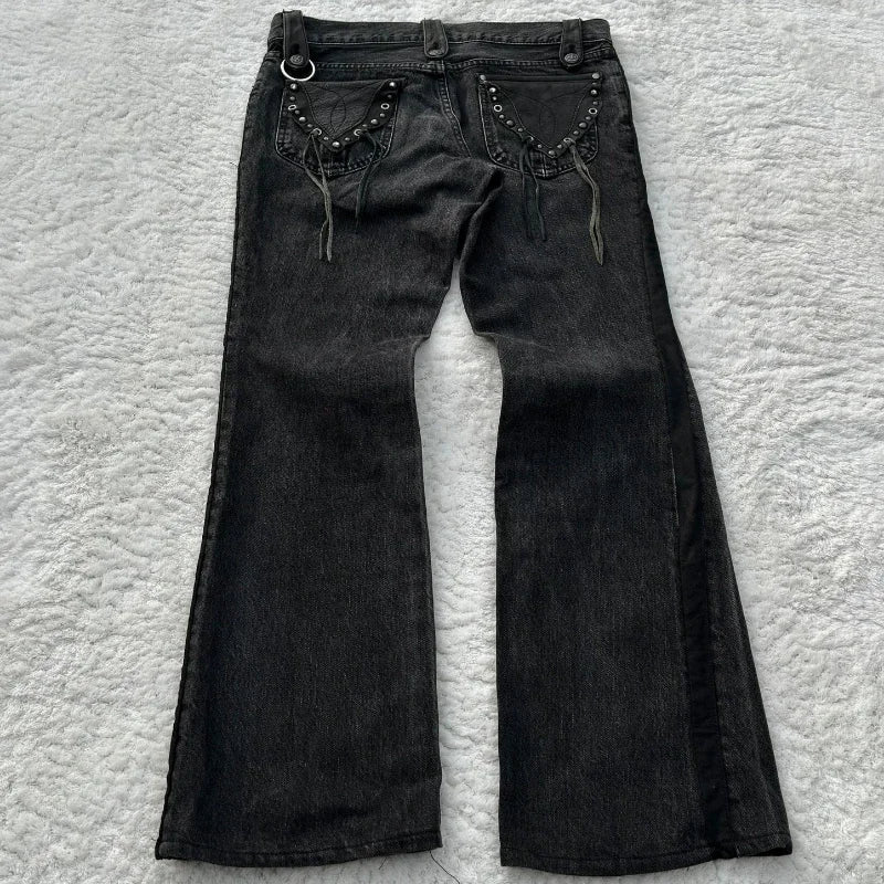 Washed denim jeans with decorative pockets