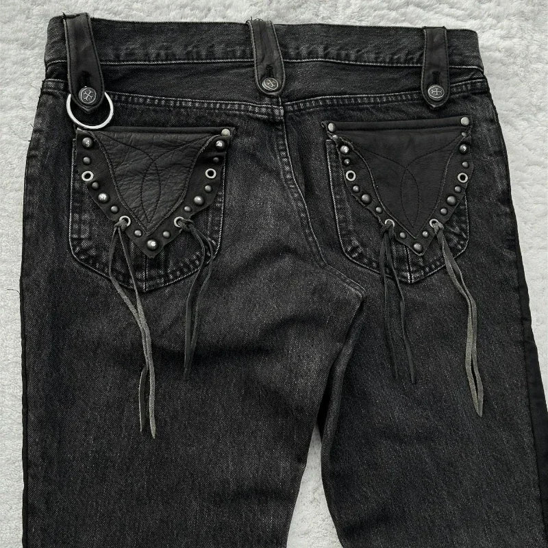 Washed denim jeans with decorative pockets